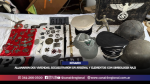 ROSARIO: ALLANARON DOS VIVIENDAS EN EMPALME GRANEROS, SECUESTRARON UN ARSENAL Y ELEMENTOS CON SIMBOLOGÍA NAZI